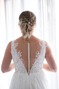 Clearwater Beach Bride in Delicate Floral Lace, Illusion V Back and Rhinestone Buttons, Updo Hairstyle with Pearls | Tampa Bay Wedding Photographer Carrie Wildes | Wedding Hair and Makeup Femme Akoi Beauty Studio | Wedding Dress Truly Forever Bridal