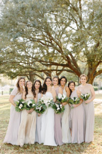 Classic Bride with Bridesmaids in Neutral Taupe Mix and Match Dresses Holding Tropical White Floral Bouquets | Tampa Bay Wedding Florist and Designer John Campbell Weddings