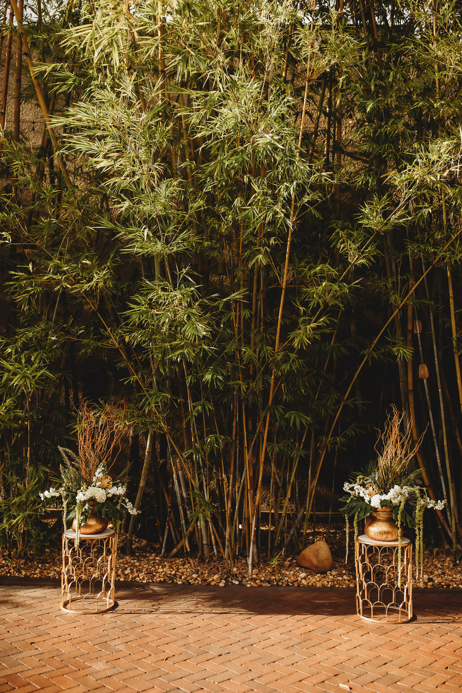 Modern Tropical Inspired Florida Wedding Ceremony in Bamboo Garden, DIY Floral Centerpieces with Bronze Base and Greenery | Downtown St. Pete Historic Wedding Venue NOVA 535 - Courtyard