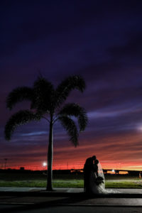 Florida Bride and Groom Embrace at Sunset | Tampa Heights Riverwalk | Tampa Bay Wedding Photographer Lifelong Photography Studios