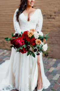 Outdoor Street Bridal Portrait | Downtown Tampa Heights Christmas Wedding | Long Sleeve Lace Plunging V Neck Tulle Ballgown Wedding Dress Bridal Gown with Long Cathedral Veil | Red Burgundy and Gold Rose Bridal Bouquet | Dewitt for Love Photography