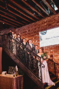 Downtown St. Pete Wedding Party on Iron Rod Staircase of Historic Building with Exposed Brick Wall | Florida Unique Wedding Venue NOVA 535