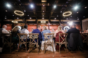 Custom Wedding Seat Signs "My Sun and Stars" "Moon of my life" on Back of Crossback Chairs at Armature Works The Gathering Reception Room | Florida Day of Wedding Coordinator Special Moments Event Planning | Tampa Bay Wedding Photographer Lifelong Photography Studio