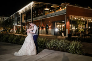 Tampa Heights Bride and Groom Intimate Embrace Outside Armature Works Wedding Venue in Downtown Tampa | Florida Wedding Photographer Lifelong Photography Studio