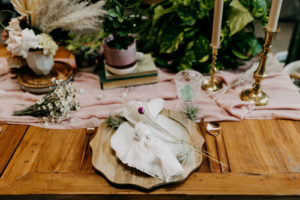 Boho Neutral Styled Shoot Decor | Wooden Charger, White Linens, Rose Gold Flatware and Candlesticks, White Flowers, Pampas Grass Pink Table Runner | Wedding Planner Elope Tampa Bay | Amber McWhorter Photography | Wooden Chargers and Flatware Rentals Kate Ryan Event Rentals