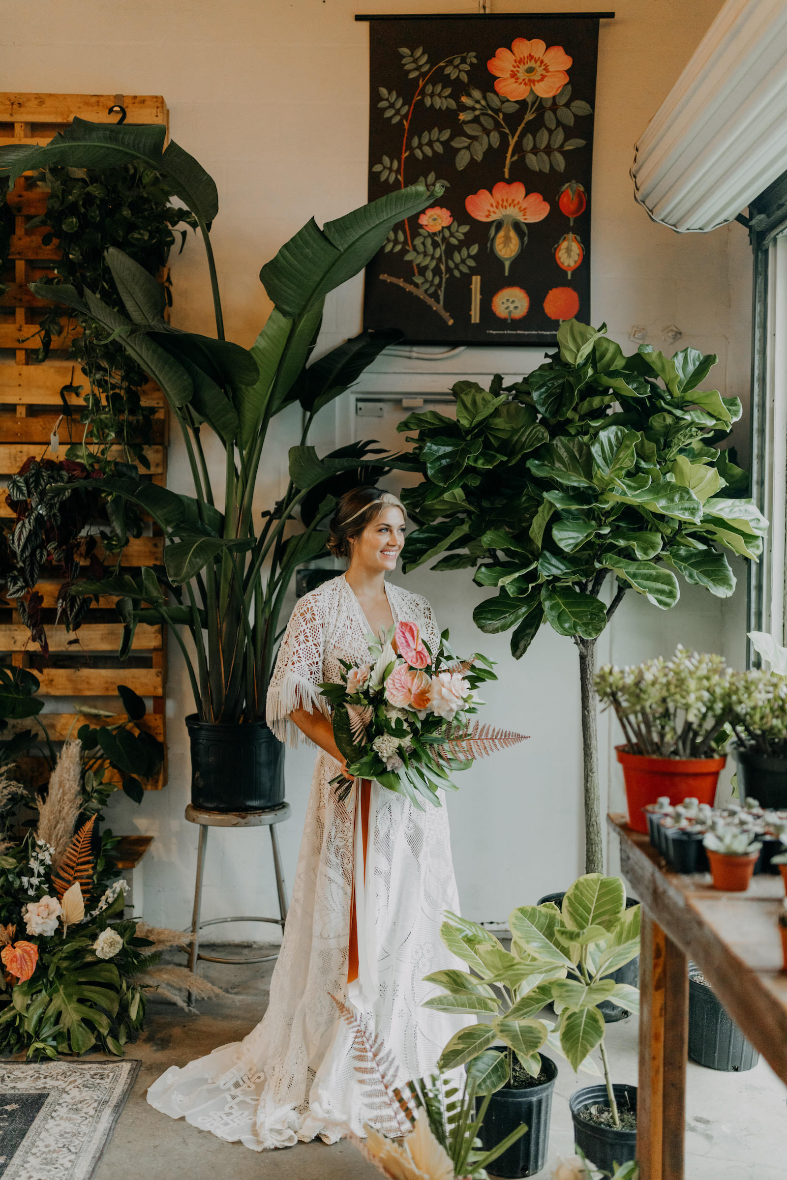 Boho Neutral Styled Shoot | Bohemian Bride in Lace, Illusion and Fringe Short Sleeve Vintage Wedding Dress Holding Unique Tropical Palm Tree Leaves, Pink Anthurium, Ivory Floral Wedding Bouquet | St. Pete Wedding Venue Wild Roots Nursery | Wedding Planner Elope Tampa Bay | Amber McWhorter Photography