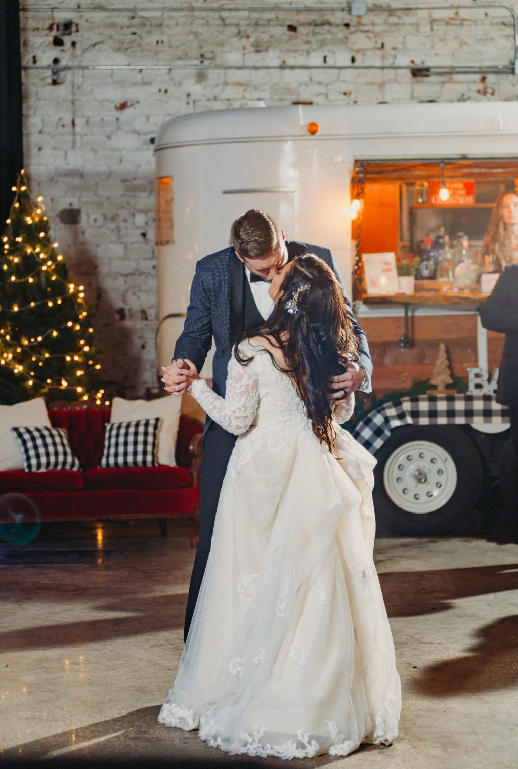 Bride and Groom First Dance | Long Sleeve Lace Plunging V Neck Tulle Ballgown Wedding Dress Bridal Gown with Long Cathedral Veil | Groom Wearing Navy Blue Jacket with Black Satin Lapel and Bow Tie | Dewitt for Love | Grant Hemond
