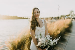 Modern Neutral Bride in Draped Neckline Wedding Dress Holding All White Floral Bouquet | Tampa Bay Wedding Photographer Amber McWhorter