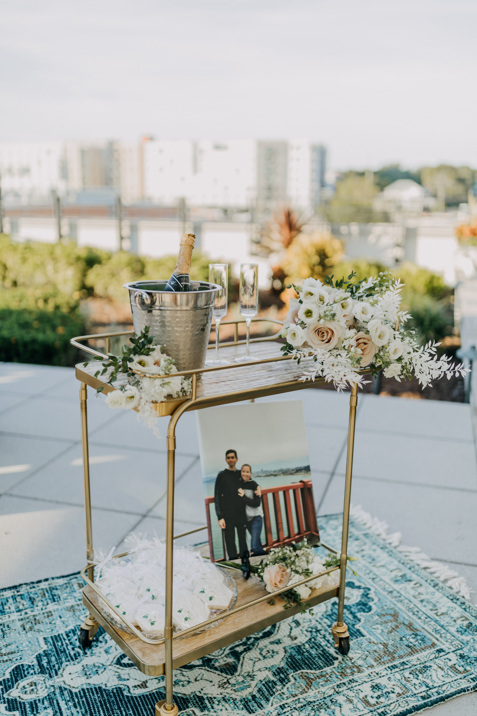 Modern Gold Bar Cart with Champagne, Neutral Floral Bouquets, Wedding Dessert Cookies | Wedding Planner Elope Tampa Bay | Wedding Photographer Amber McWhorter