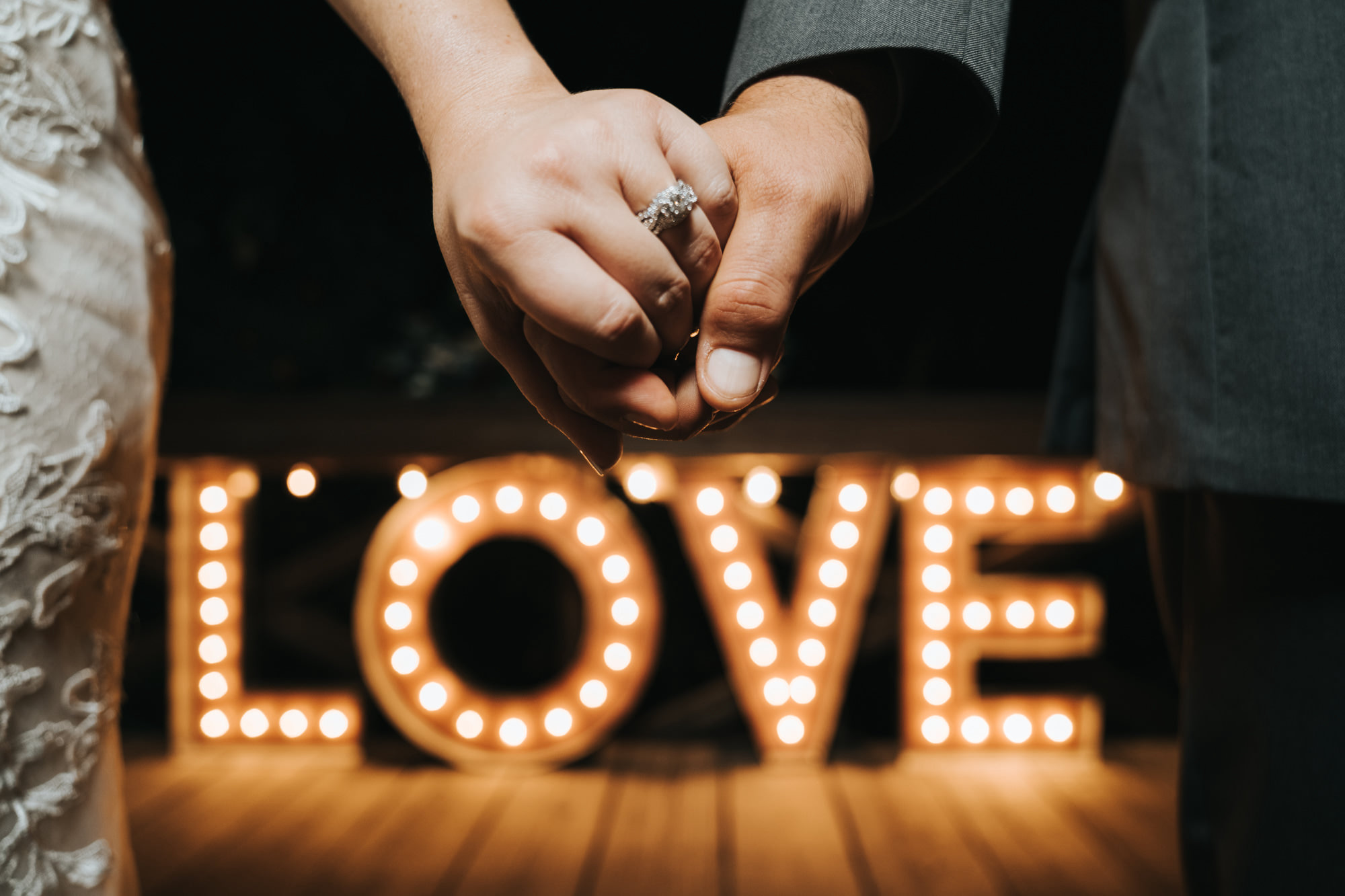Bride and Groom Holding Hands | Wedding Ring Shot | Wedding Marquee Light Up Letters LOVE