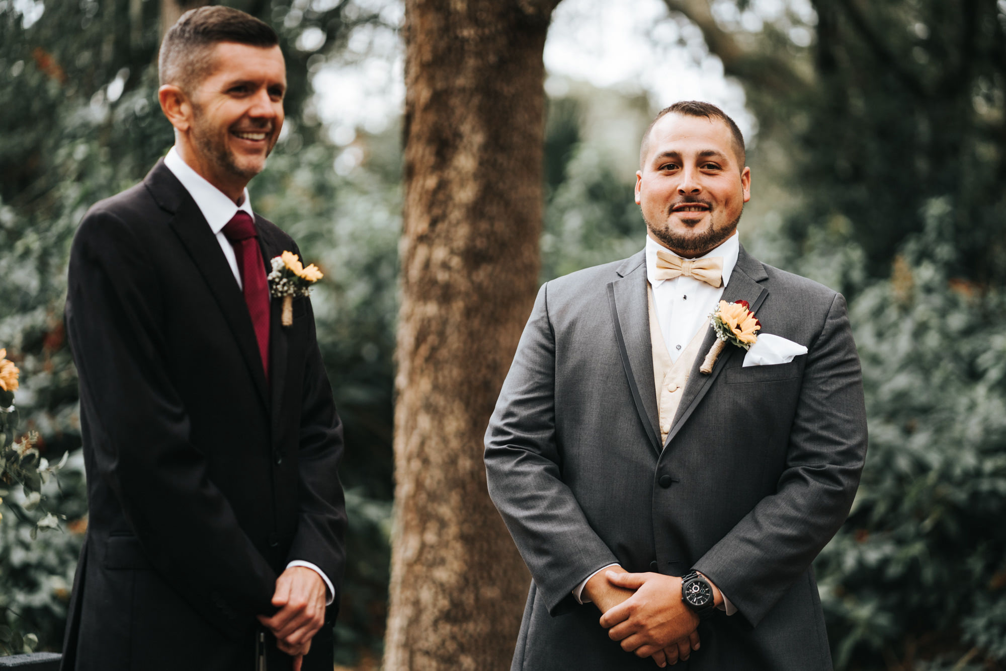 Groom Wearing Classic Charcoal Grey Gray Suit with Champagne Bow Tie and Vest and Yellow Sunflower Boutonniere