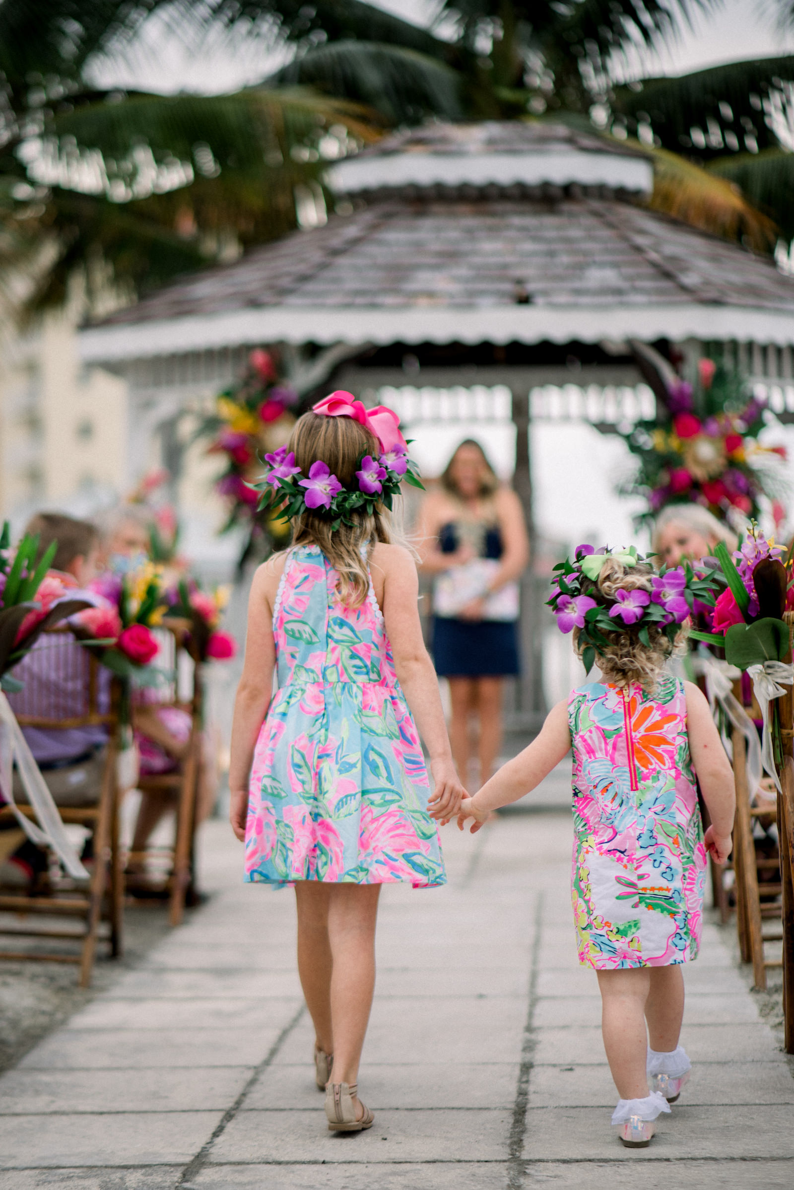 Tropical Florida Wedding Ceremony With Lilly Pulitzer Themed Flower Girl Wearing Purple Hibiscus Flower Crowns | Tampa Bay Vow Renewal and Micro wedding Planner Perfecting The Plan | St. Petersburg Private Beachfront Venue Isla Del Sol | St. Pete Beach DJ Grant Hemond & Associates