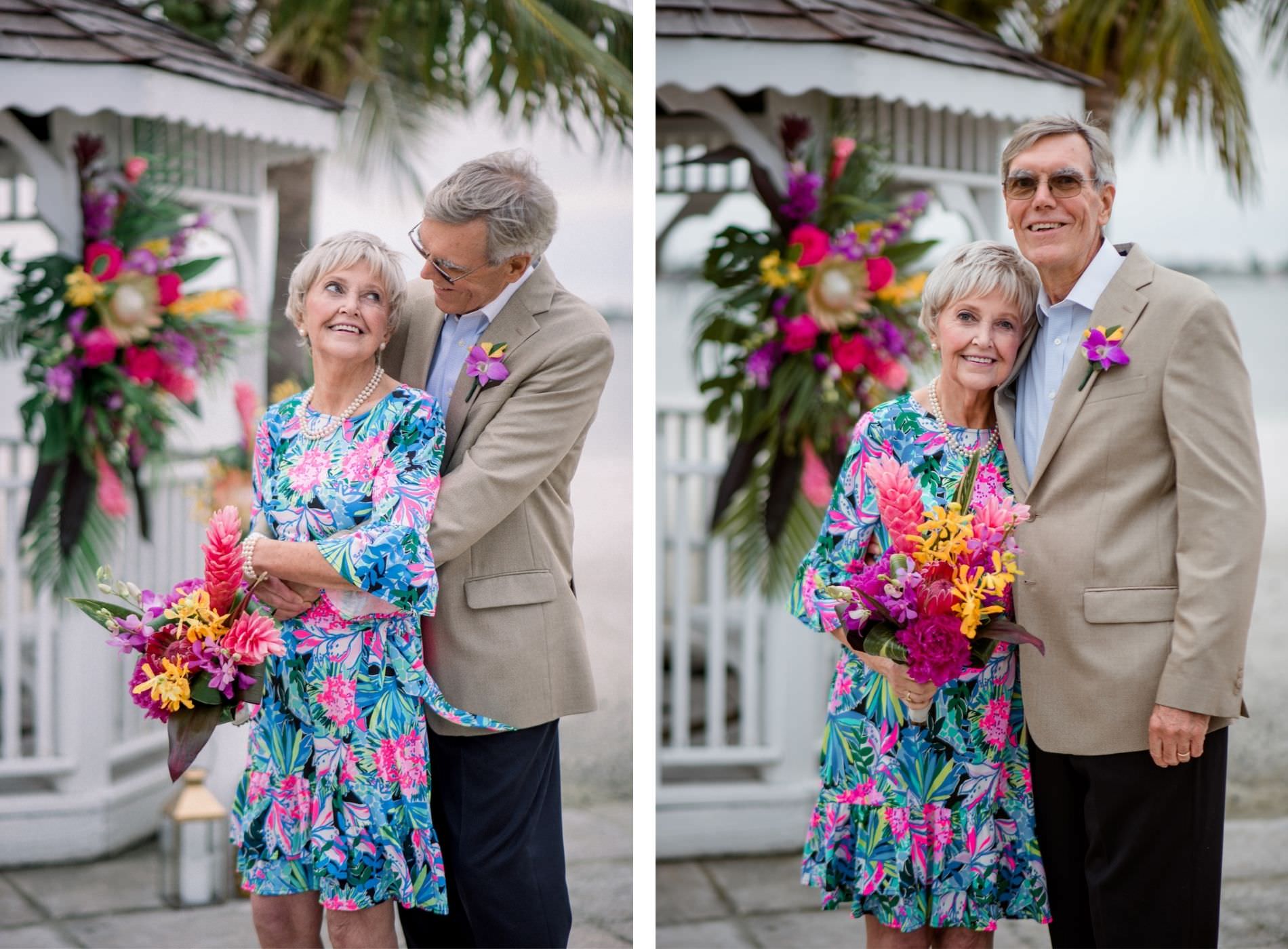 Florida Husband and Wife at Tropical Wedding Vow Renewal Ceremony with Decor, Lilly Pulitzer Themed Attire, and Floral Arrangements, Gazebo Alter with Bright Pink Exotic Flowers, Purple Stems, Blush King Proteas, with Green Palms and Monstera Leafs | Tampa Bay Vow Renewal and Micro wedding Planner Perfecting The Plan | St. Petersburg Private Beachfront Venue Isla Del Sol