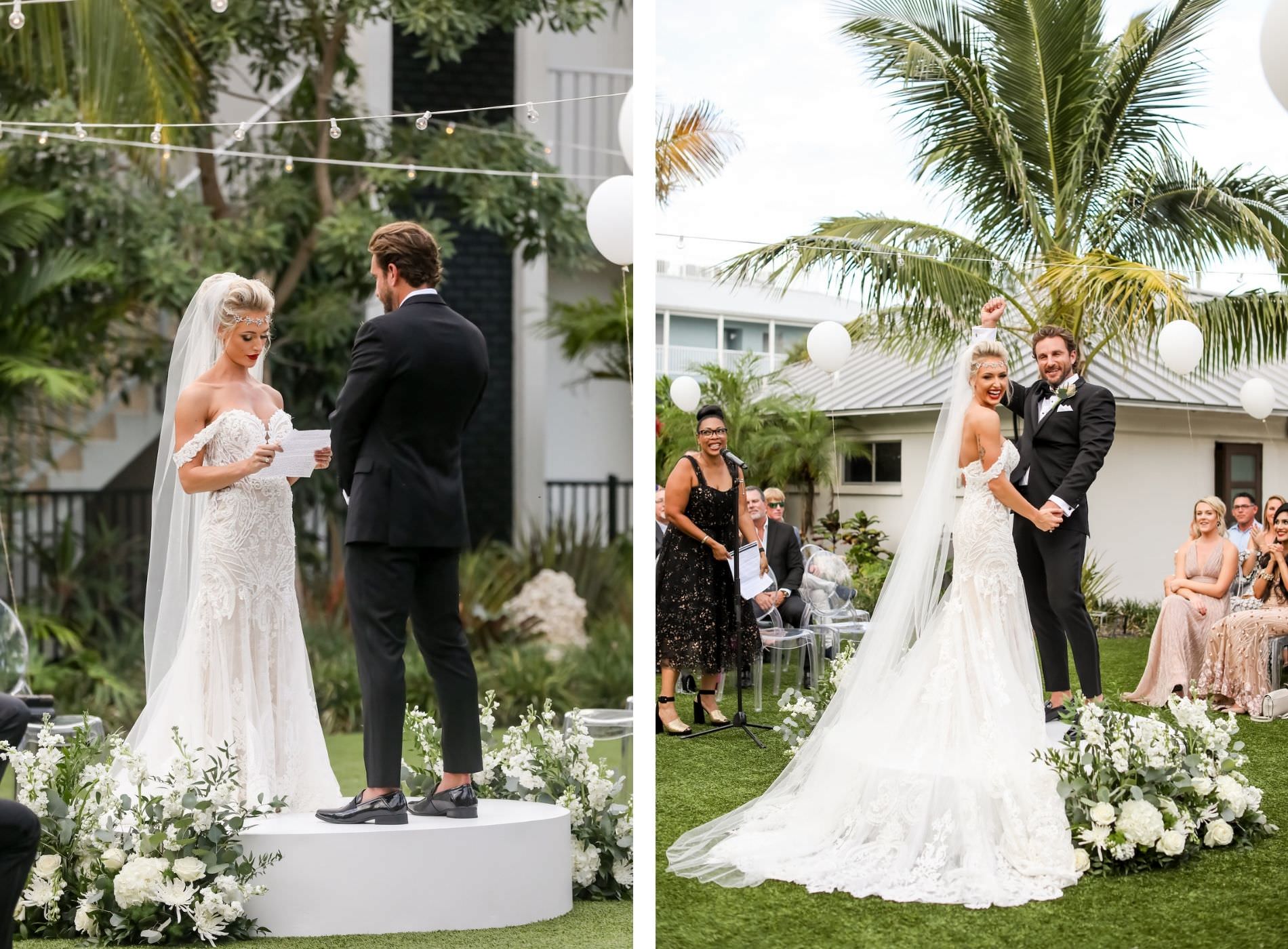 Florida Bride and Groom Vow Exchange on Custom Built Wedding Stage, Surrounded by Family and Friends on Acrylic Ghost Chairs, Tropical Elegant Inspired Floral Arrangements with Whtie and Ivory Flowers with Greenery | Sarasota Wedding Planner Kelly Kennedy Weddings | Florida Wedding Photographer Lifelong Photography Studio