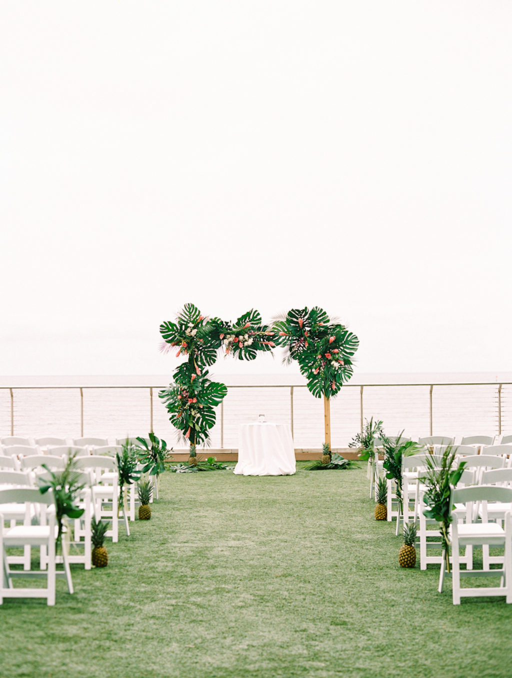Tropical Elegant Waterfront Wedding Ceremony Decor, Arch with Palm Tree Leaves and Flowers | Tampa Bay Wedding Planner Special Moments Event Planning | Clearwater Beach Wedding Venue Opal Sands Resort