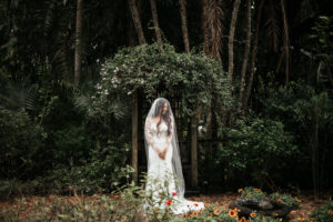 Tropical Elegant Inspired Florida Bride at Sunken Gardens in St. Petersburg, Bride Wearing BHLDN Wedding Dress with Long Illusion Lace Sleeves with Veils | Tampa Bay Wedding Planner John Campbell Weddings