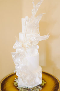 Modern All White Wedding Cake with Sugar Sculpture from Tampa Bay Baker The Artistic Whisk