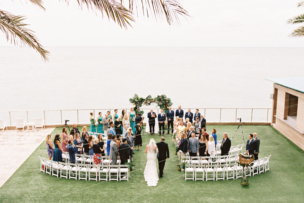 Tropical Elegant Waterfront Wedding Ceremony, Bride Walking Down the Aisle | Tampa Bay Wedding Planner Special Moments Event Planning | Clearwater Beach Wedding Venue Opal Sands Resort