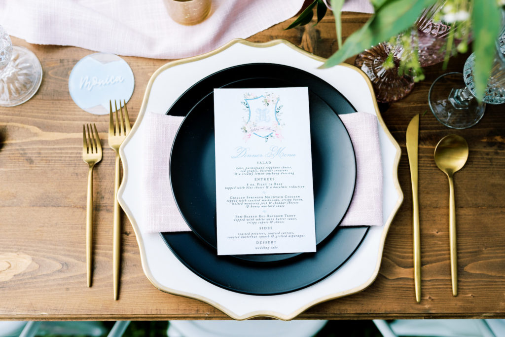 Southern Elegant Inspired Florida Outdoor Wedding Reception, White Menue with Light Blue Design, Wood Table with Dark Blue Place Setting, Gold Flatware, Pink Burlap Linens | Tampa Bay Wedding Planner EventFull Weddings | Florida Wedding Rentals Over The Top Linens