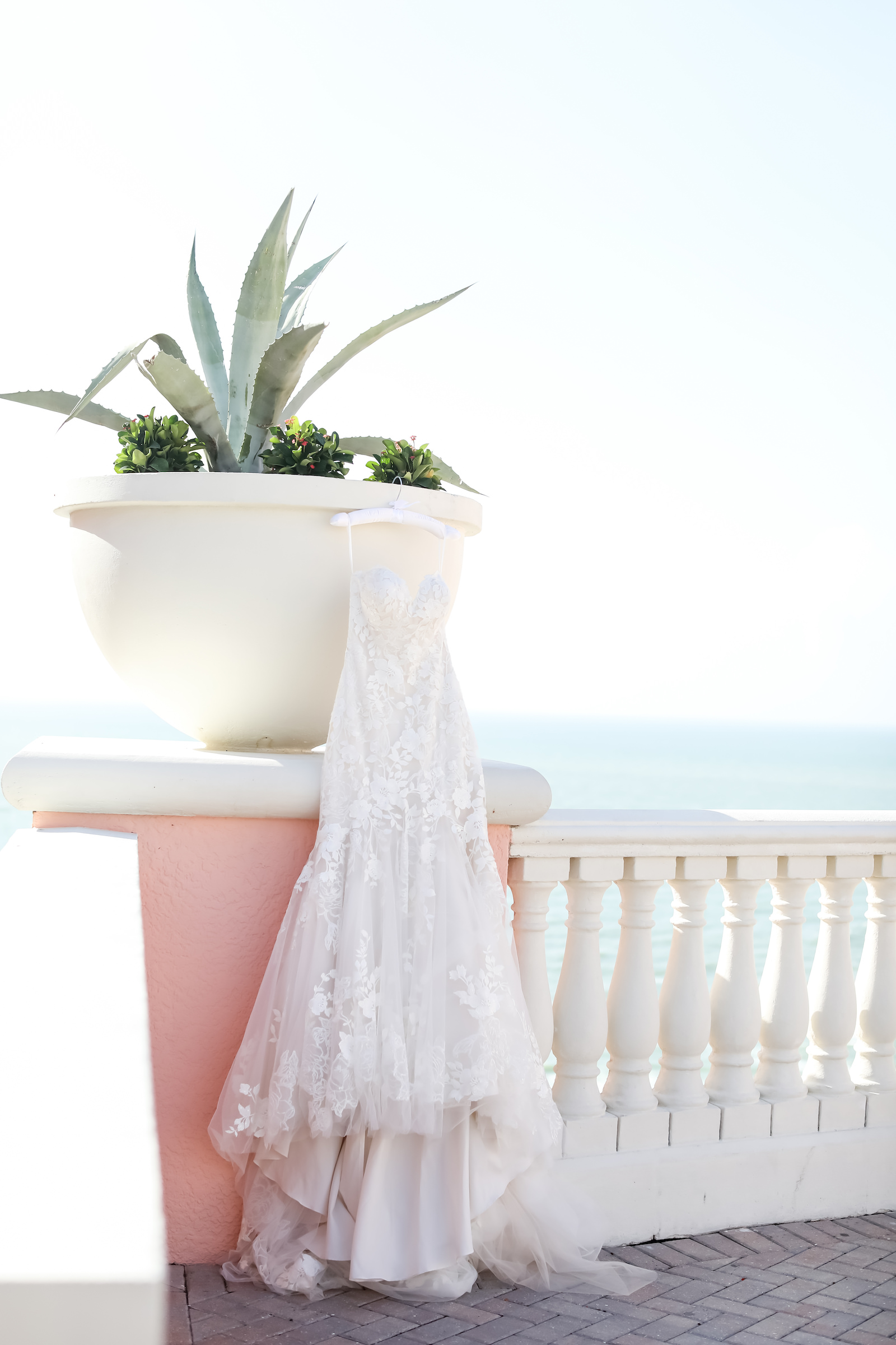 Outdoor Wedding Dress Hanger Shot at Clearwater Wedding Venue Hyatt Regency Clearwater Beach | Strapless Lace Sweetheart Mermaid Wedding Dress Bridal Gown