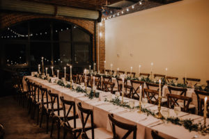 Rustic Boho Wedding Reception Feasting Tables with Gold Candle Centerpieces, Greenery Garland, and French Country Chairs | St. Pete Wedding Florist Posies Flower Truck