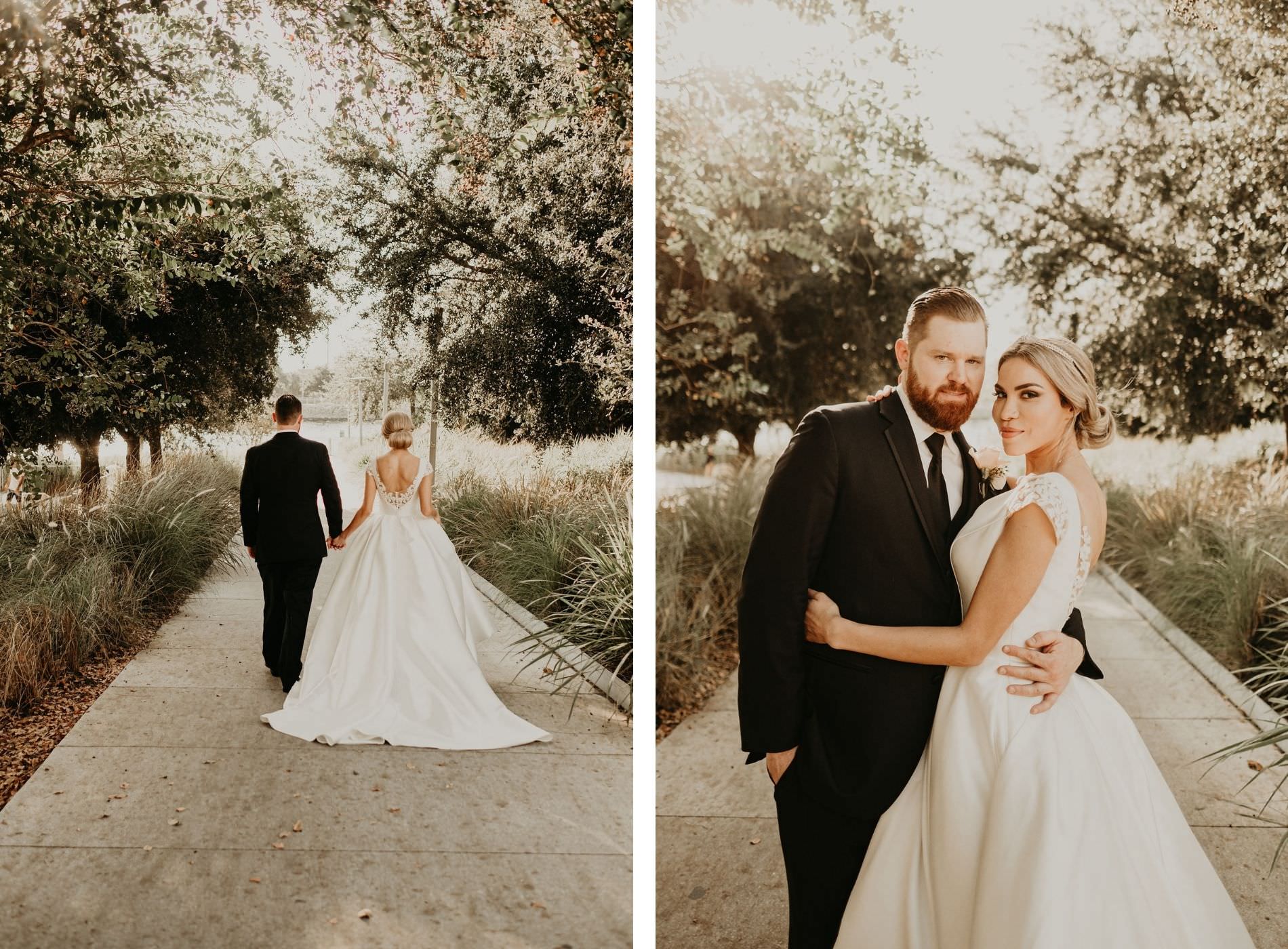 Outdoor Bride and Groom Portrait with Tree Lined Sidewalk | V Neck Low Back Mikado Satin and Lace Ballgown Wedding Dress by Anomalie | Groom wearing Classic Black Suit Tux