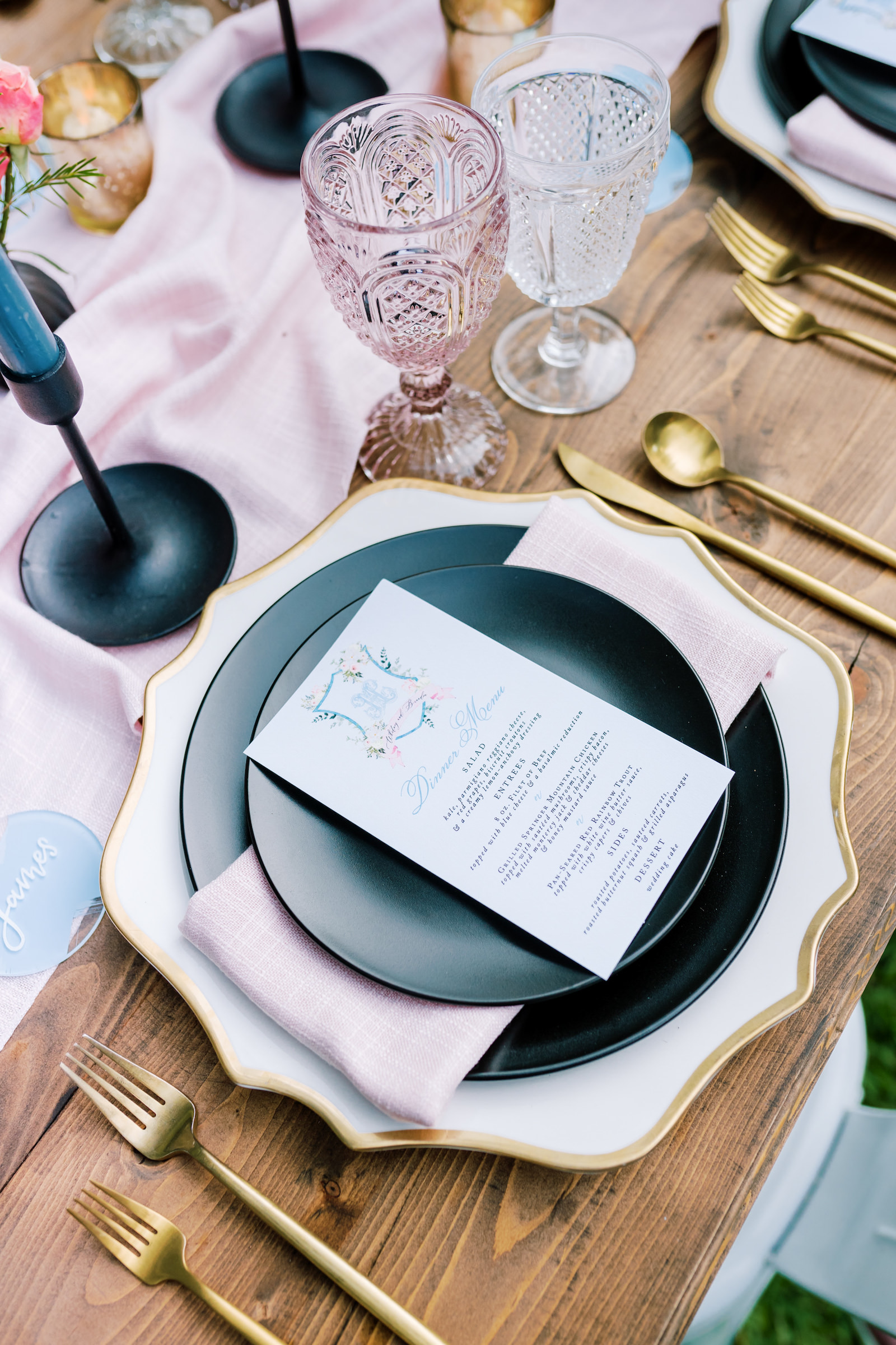 Southern Elegant Inspired Florida Outdoor Wedding Reception, Wood Table with Dark Blue Place Setting, Gold Flatware, Pink Burlap Linens, Multicolored Glass Goblets, Floral Centerpiece with Magnolia Leaves | Tampa Bay Wedding Planner EventFull Weddings | Florida Wedding Rentals Over The Top Linens
