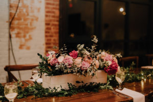 Rustic Boho Wedding Reception with Boxed Red and Pink Floral Centerpieces and Greenery Garland | St. Pete Wedding Florist Posies Flower Truck