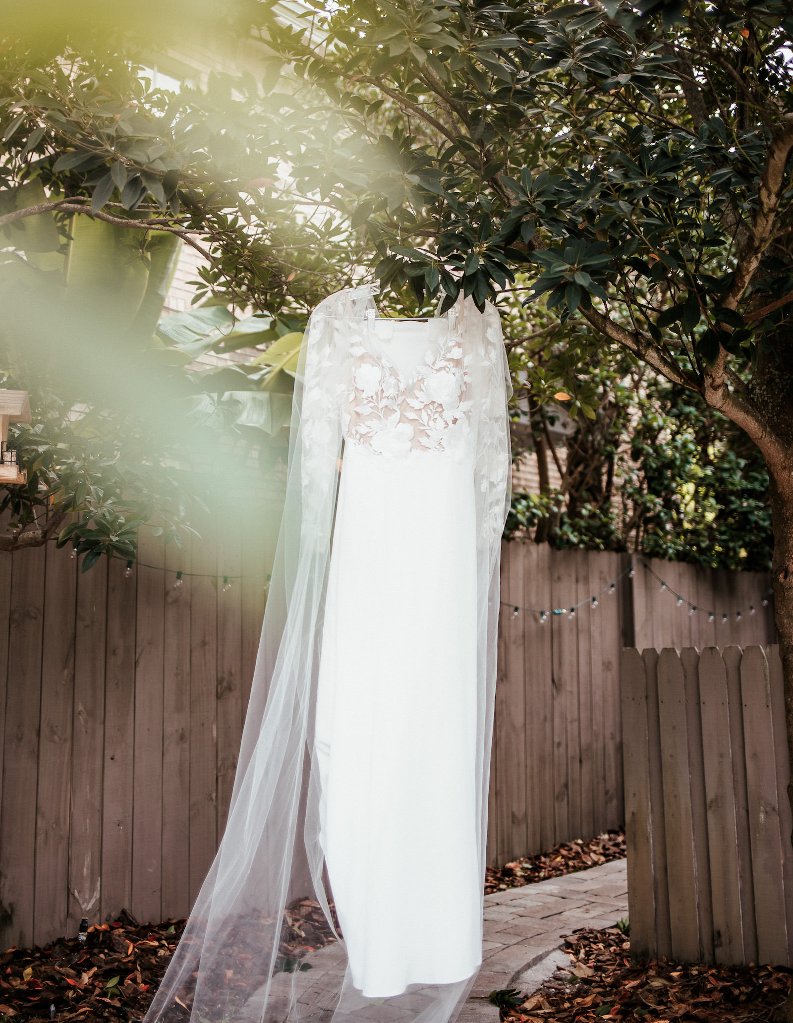 Modern Tropical Wedding Dress Hanging From Tree, BHLDN Long Sleeve Illusion Lace Dress