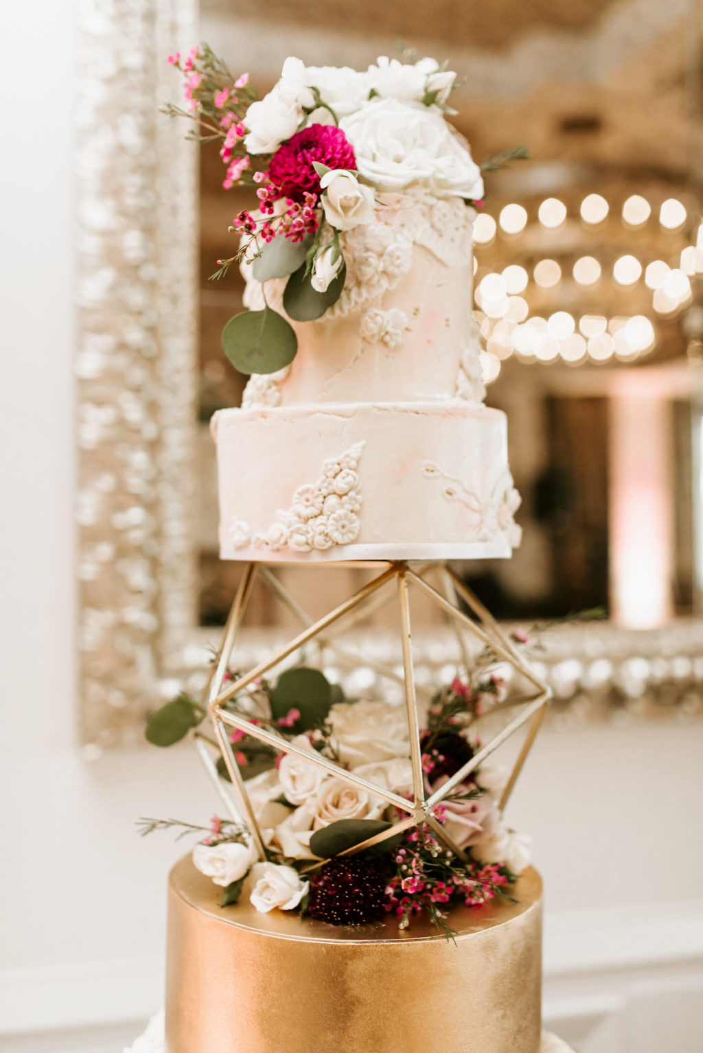 Four Tier Wedding Cake with Gold Geometric Orb Layer by Tampa Cake Baker The Artistic Whisk | Piped Lace Buttercream Fondant Victorian Fancy Wedding Cake with White and Red Fresh Flowers Roses and Greenery
