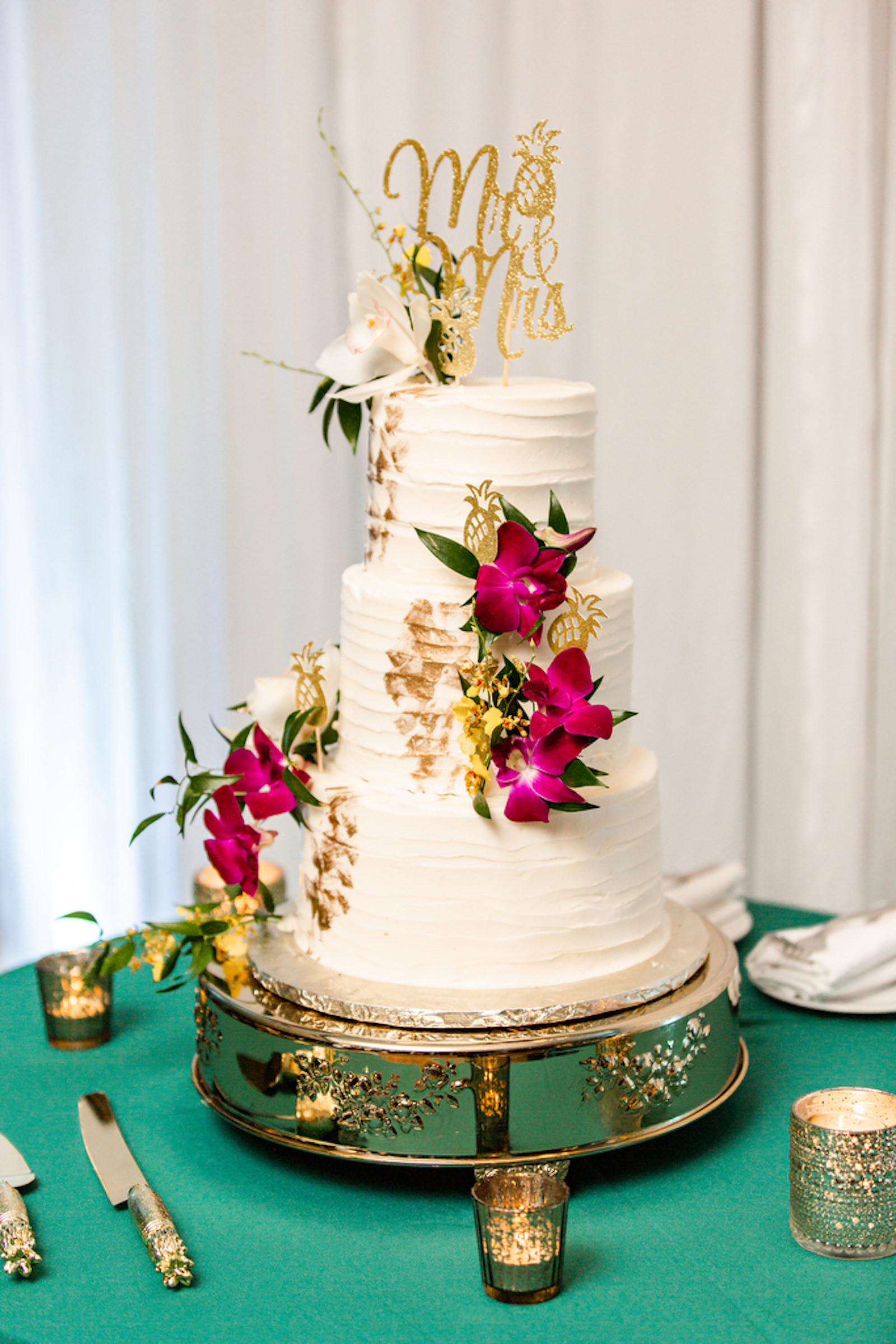 Tropical Three Tier Elegant White Wedding Cake with Purple Orchids, White Flower, Gold Cake Topper