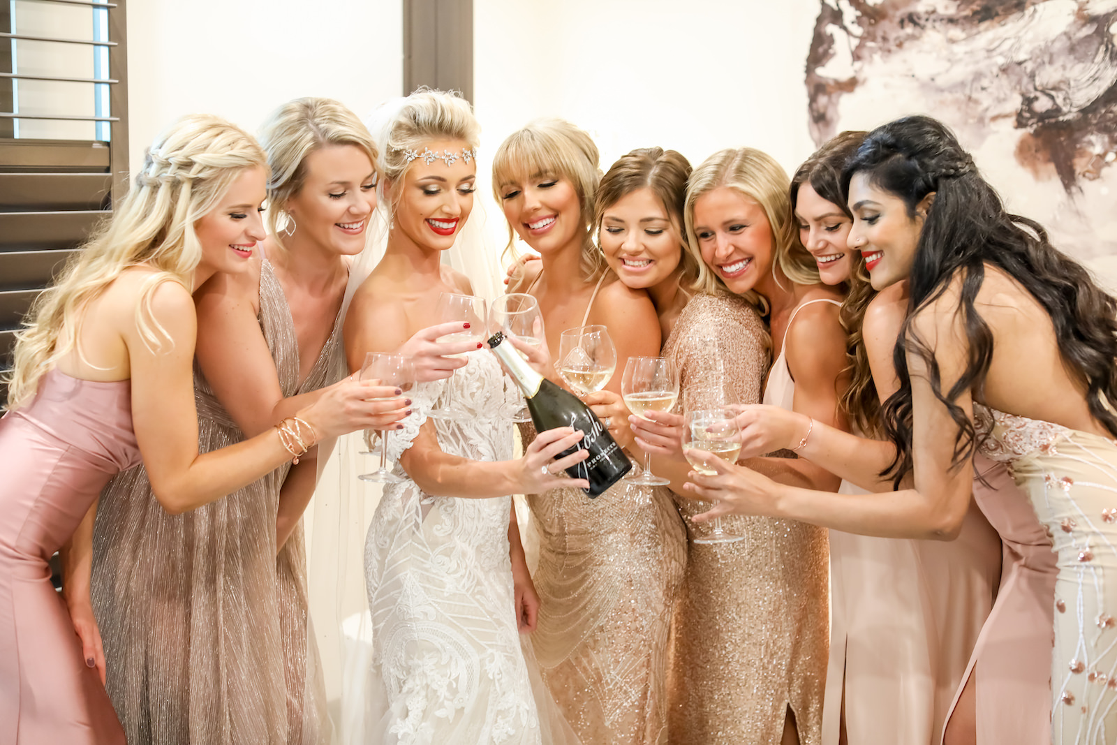 Vintage Inspired Florida Bride with Bridesmaids Popping Champagne in Mismatched 1920's Glamour Long Dresses Bride Wearing Crystal Headband with Veil, Off the Shoulder Lace Wedding Dress | Sarasota Wedding Planner Kelly Kennedy Weddings | Tampa Bay Wedding Photographer Lifelong Photography Studio