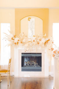 Trendy and Modern Boho Wedding Decor, White and Beige Preserved Florals and Foliage Bouquet on Fireplace Mantel | Tampa Bay Wedding Planner, Florist and Designer John Campbell Weddings