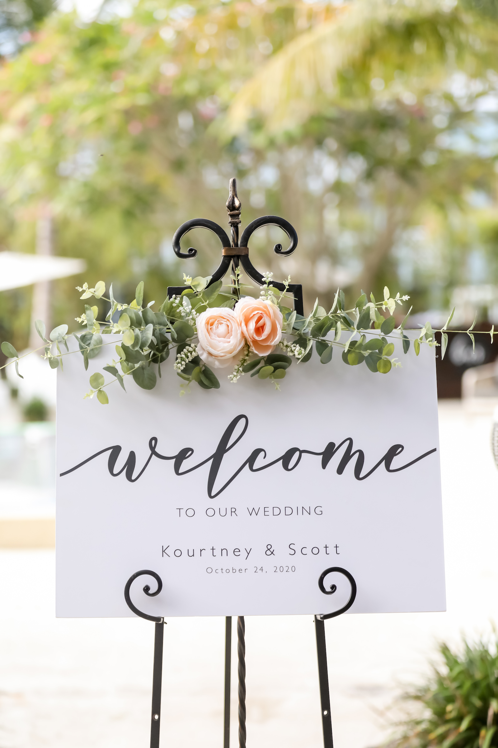 Modern Wedding Ceremony Decor, Black and White Welcome Sign topped with Light Pink Floral Arrangement with Greenery | Florida Wedding Photographer Lifelong Photography Studio | Anna Marie Island Wedding Planner and Coordinator Kelly Kennedy Weddings