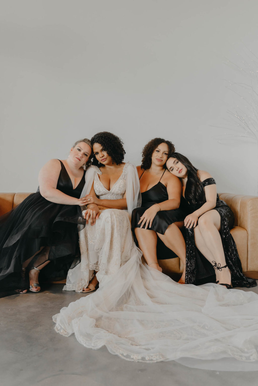 Indoor Bridal Party Portrait in Tampa Wedding Venue Hyde House | Illusion Lace Embroidered Beaded V Neck Wedding Dress Bridal Gown with Sheer Tulle Cape Sleeves by Designer Amalia Carrara Bridal | Black Formal Elegant Bridesmaid Dresses