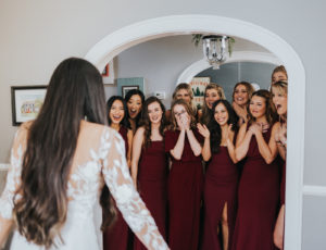 Tampa Bay Bride and Bridesmaids First Look, Florida Bride Wearing BHLDN Long Sleeve Wedding Dress, Bridesmaids in Long Mismatched Wine Burgundy Dresses From BHLDN