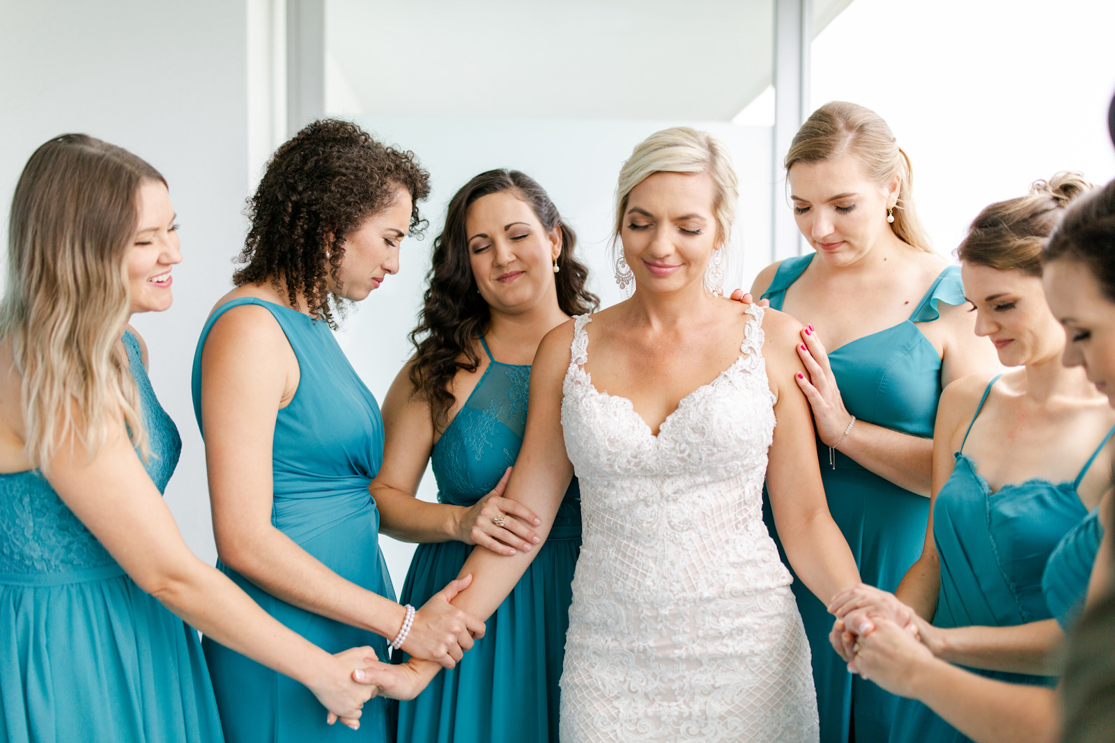 Tampa Bay Bride in Lace V Neckline Wedding Dress with Straps Praying with Bridesmaids in Mix and Match Teal Dresses
