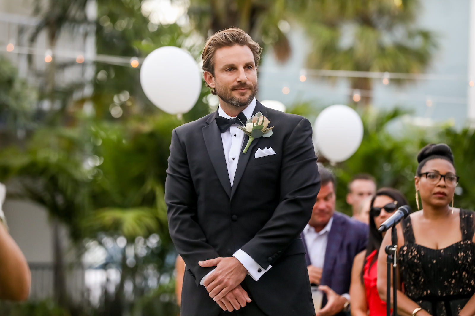 Sarasota Groom Stands at Alter Seeing Bride For First Time, With Tropical Inspired Boutonnière | Sarasota Wedding Planner Kelly Kennedy Weddings | Florida Wedding Photographer Lifelong Photography Studio