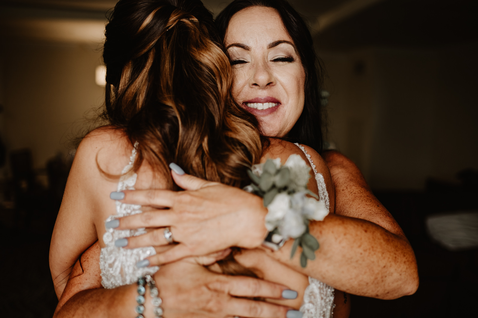 Bride Getting Ready | Mother of the Bride and Bride Embrace Hug