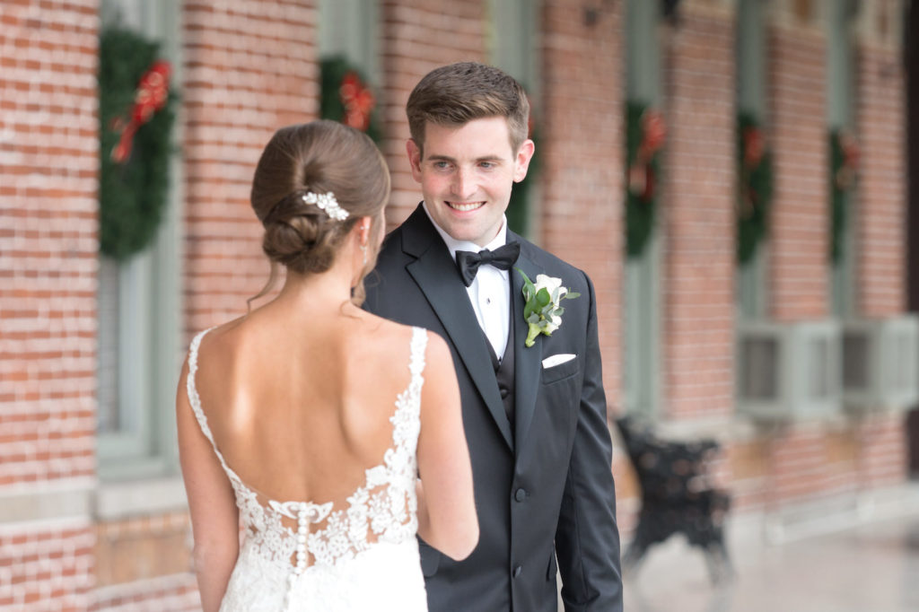 Downtown Tampa Wedding Bride and Groom First Look at University of Tampa Plant Museum | Groom Wearing Classic Black Suit Tux | Carrie Wildes Photography