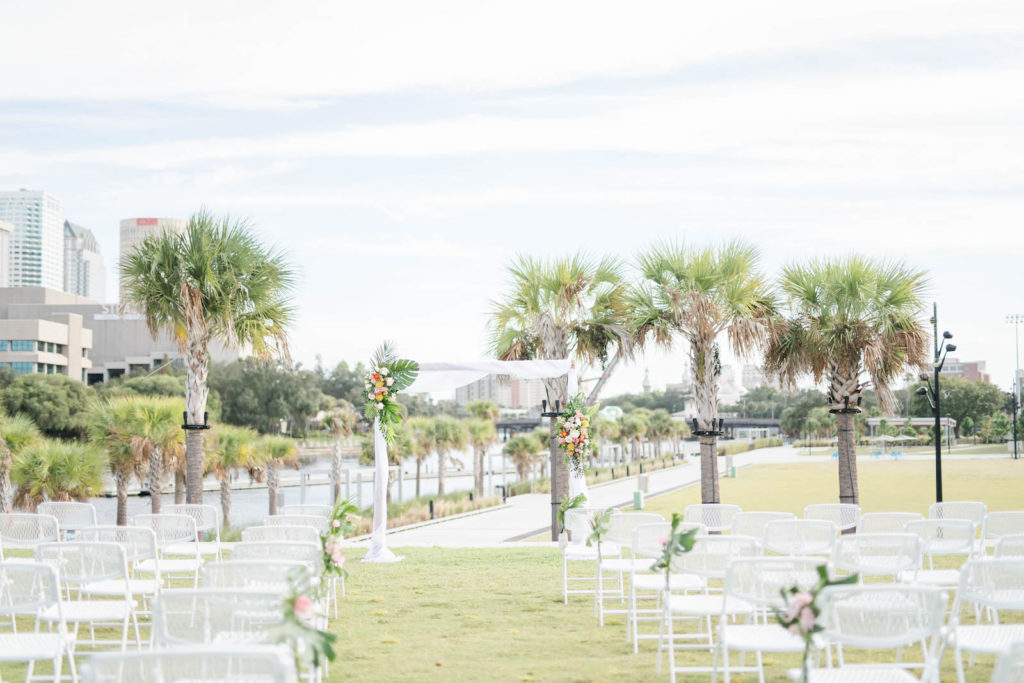 Tropical Outdoor Wedding Ceremony Decor, Arch with Monstera Palm Leaves Colorful Flower Arrangements | Tampa Bay Wedding Planner Coastal Coordinating