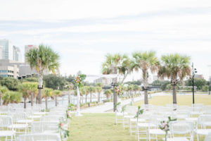 Tropical Outdoor Wedding Ceremony Decor, Arch with Monstera Palm Leaves Colorful Flower Arrangements | Tampa Bay Wedding Planner Coastal Coordinating