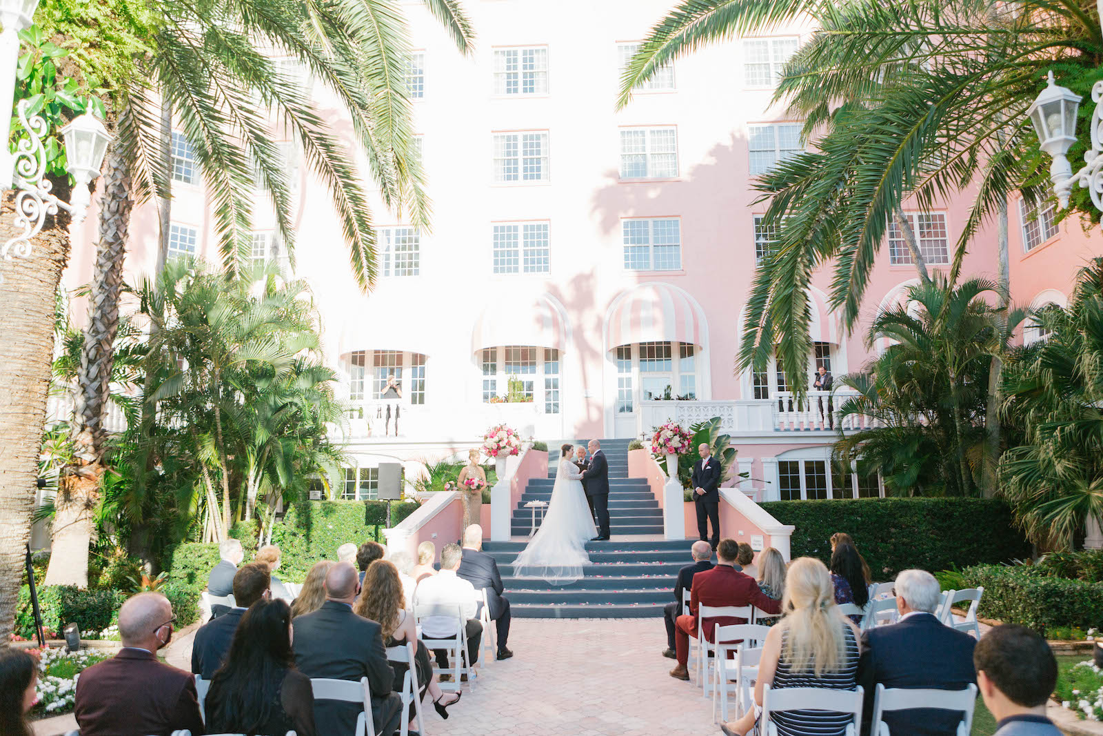 Florida Bride and Groom Exchanging Wedding Ceremony Vows on Steps of Historic St. Pete Wedding Venue The Don Cesar