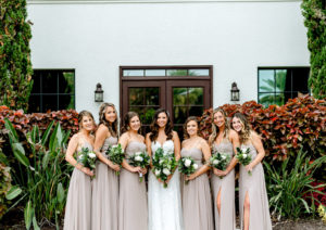 Bridal Party Outdoor Portrait at Tampa wedding Venue Westshore Yacht Club | Lace Strapless Sweetheart Scalloped Edge Train Wedding Dress Bridal Gown | Bridesmaid Bouquets with Greenery and white Roses | Long Chiffon Taupe Champagne Neutral Bridesmaid Dresses by Lulu's | Dewitt for Love Photography