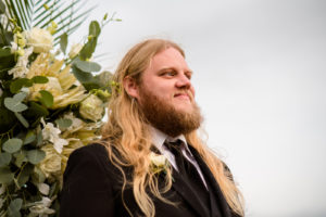 Happy Groom Reaction to Watching Bride Walking Down the Wedding Ceremony Aisle Photo