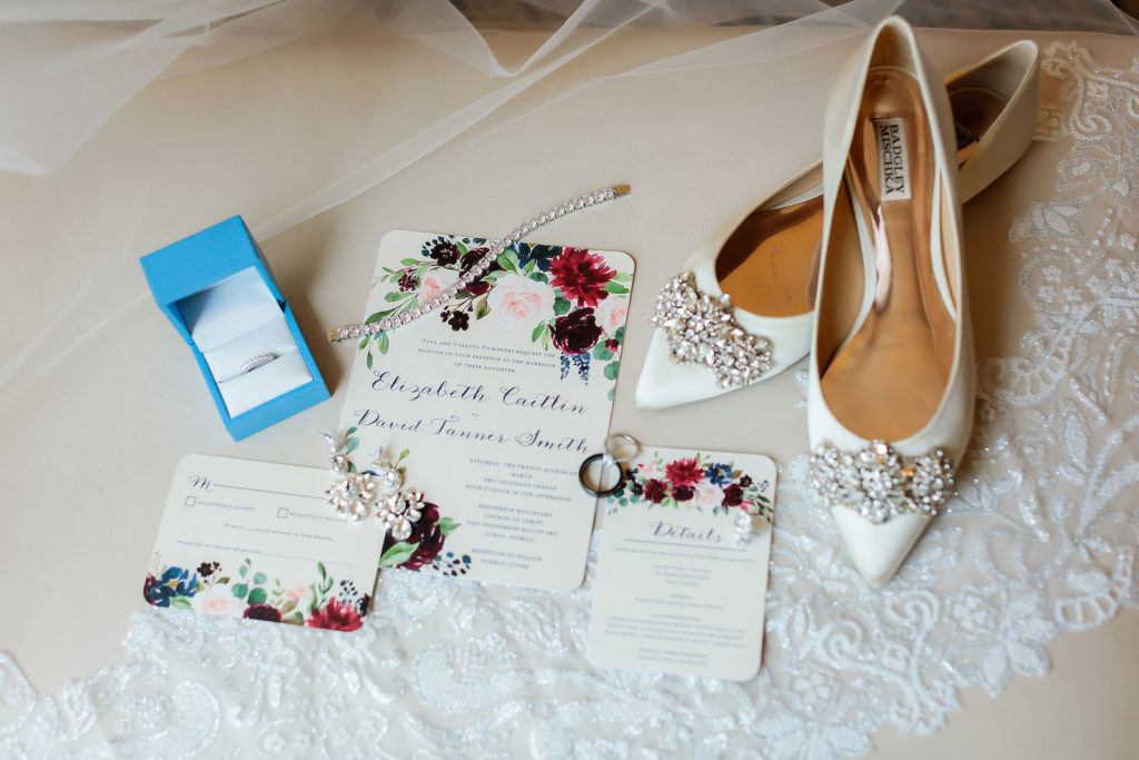 Wedding Accessories Shot with Designer Badgley Mischka Bridal Flat Shoes with Rhinestone Buckle | Watercolor Floral Wedding Invitation with Blush Pink and Berry Roses and Calligraphy