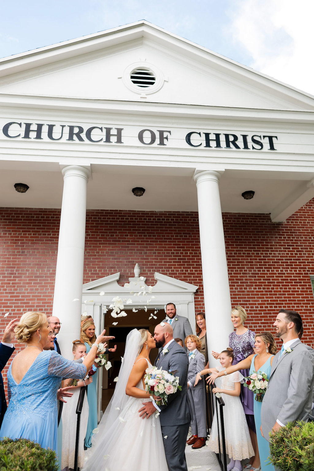 Bride and Groom Rose Petal Ceremony Exit Send Off at Traditional Tampa Church Wedding Ceremony | Henderson Boulevard Church of Christ Red Brick Church with White Columns
