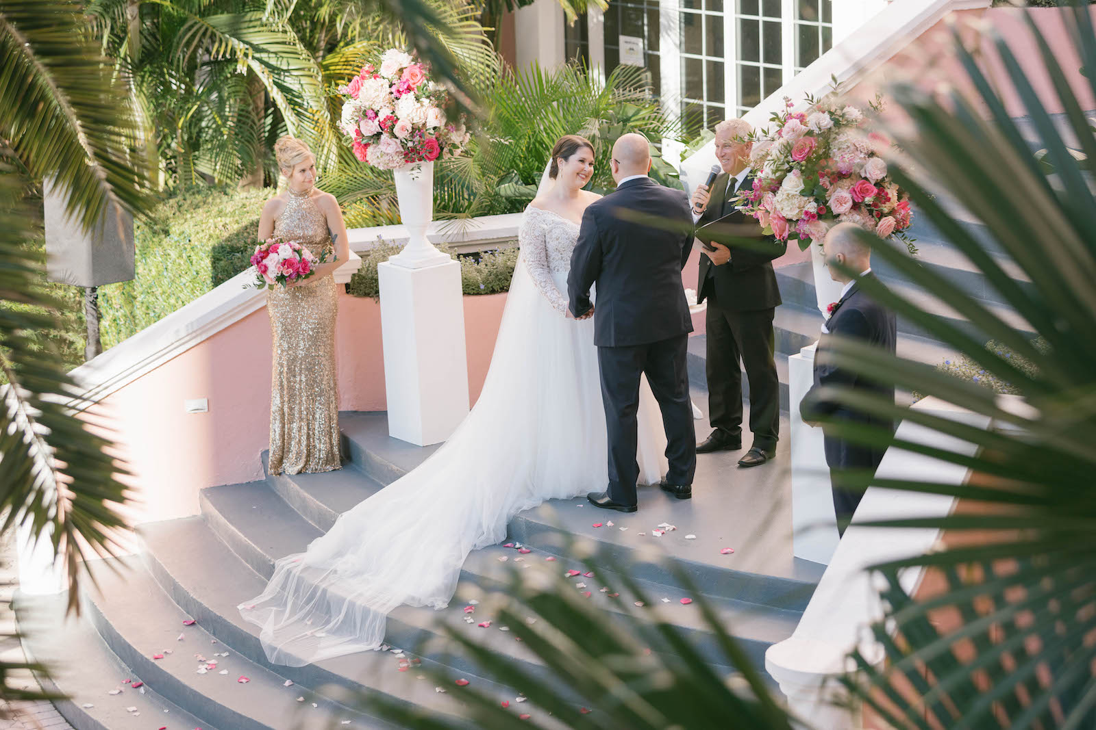 Florida Bride and Groom Exchanging Wedding Ceremony Vows on Steps of Historic St. Pete Wedding Venue The Don Cesar