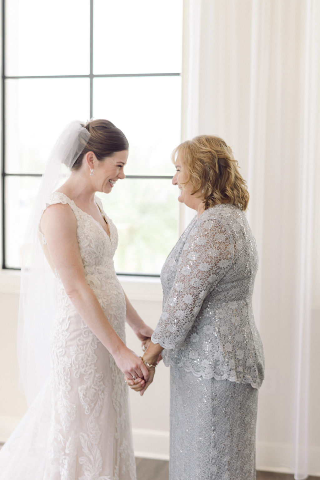 Tampa Bride and Mom Holding Hands Wedding Getting Ready Photo