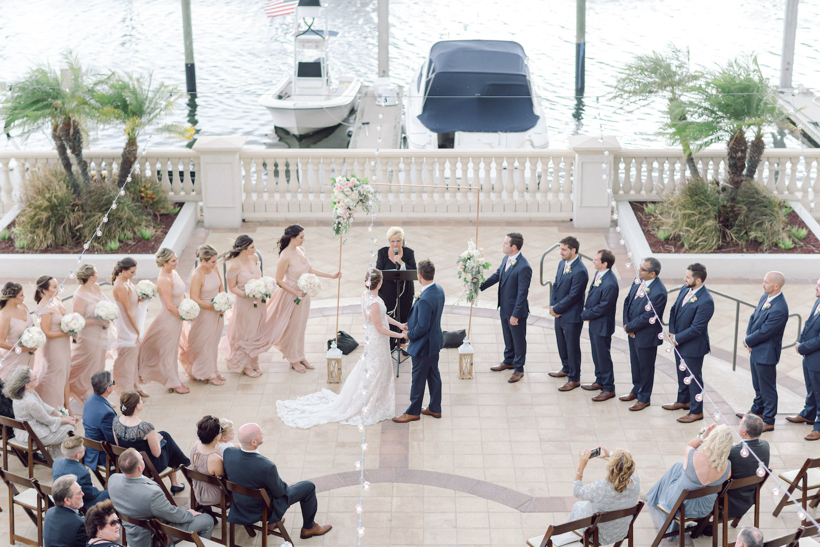 Bride and Groom Exchanging Wedding Vows During Waterfront Ceremony | Tampa Bay Wedding Venue Westshore Yacht Club